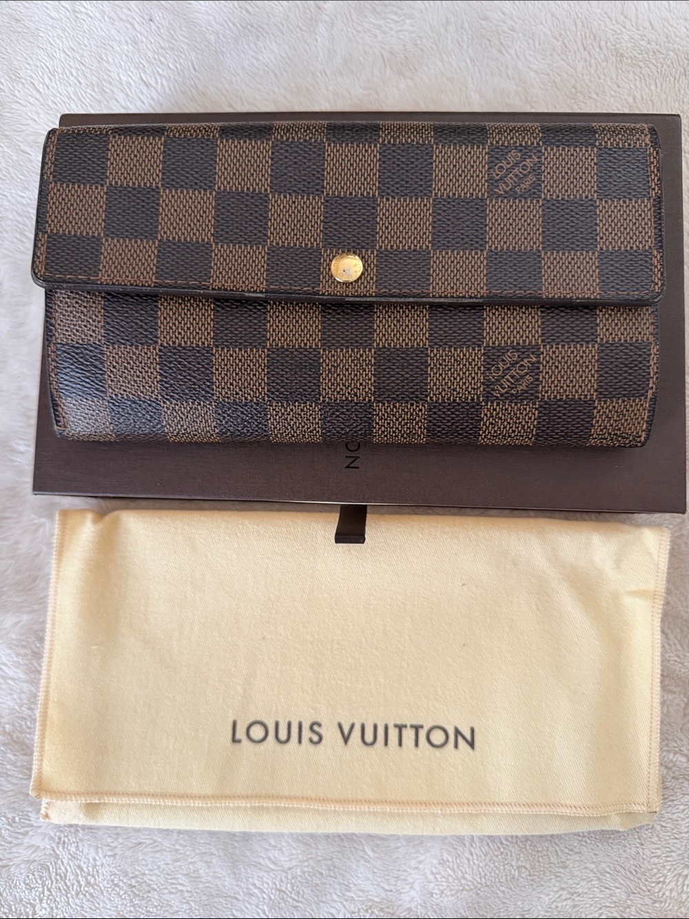 Louis Vuitton Damier Ebene Sara wallet.